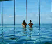 Couple - Infinity swimming pool at Watergate Bay Hotel