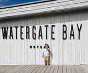 Families - Child with Watergate Bay sign