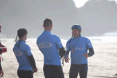 Carl Coombes team chat on the beach
