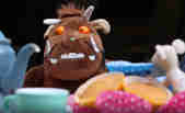 The Gruffalo sits at the table for afternoon tea in Kids' Zone