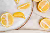 Halves of lemons scattered on a plate