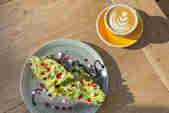 Avocado on toast and a coffee by No.1 Cubs