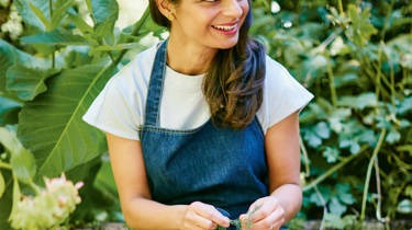 Meera Sodha sits picking fennel 