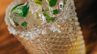 A glass of Tommys margarita cocktail 