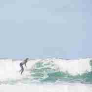 Surfer On A Big Drop