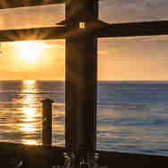 Beach Hut - restaurant - sunset over table
