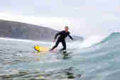 Surfer at Watergate Bay in Cornwall