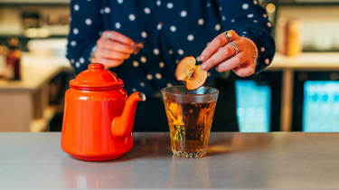 Tea pot and Cornish Christmas punch cocktail with an apple slice