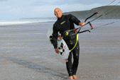 Carl Coombes walking with kitesurf