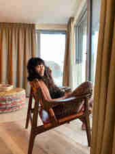Author and cook Melissa Hemsley sat in a beach loft room