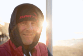 Carl Coombes smiling at the camera on Watergate Bay beach